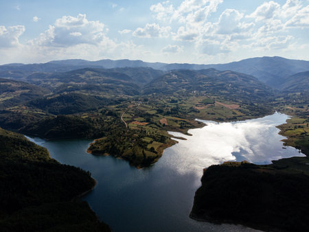 Aerial view of Rovni Lake reservoir and surrounding hilly landscape in Serbia. g.の写真素材