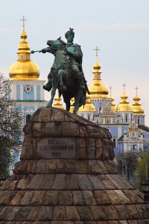 Statue of Bohdan Khmelnytsky on Sophia Square in Kyiv, Ukraine with golden domes in background. g.の写真素材