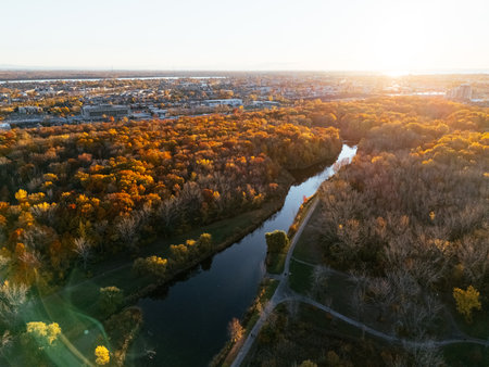Aerial view of Montreals Angrignon park and urban forest at sunset near cityscape. g.の写真素材