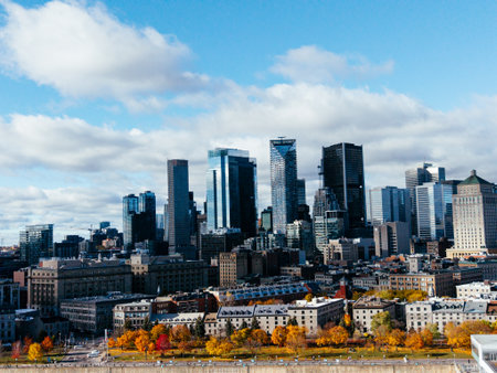Aerial view of Montreal Old Port, downtown, historic buildings and waterfront under blue sky.の写真素材