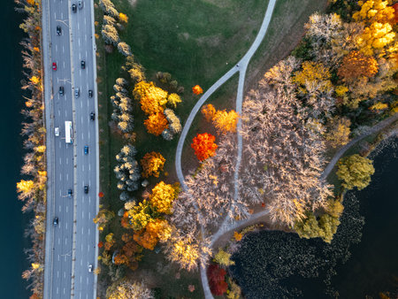 Aerial view of Montreal's Angrignon park and urban forest at sunset near cityscape.の写真素材