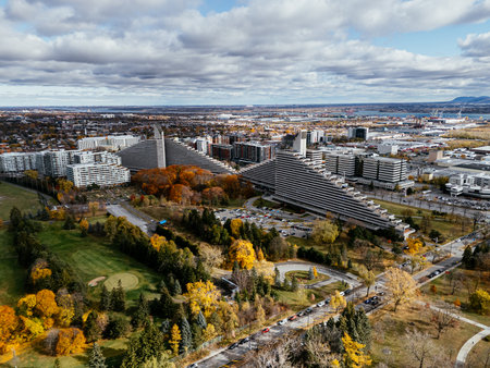 Aerial view of botanical garden fall colors in Montreal park under cloudy sky.の写真素材