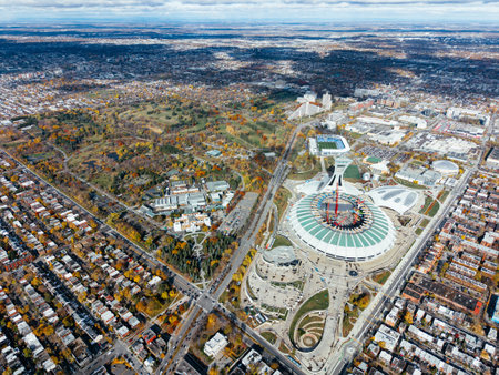 Aerial view of Olympic Stadium renovation, and botanical garden fall colors in Montreal park under cloudy sky. g.の写真素材