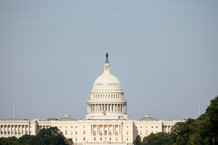 View of Washington Monument and United States Capitol with flags and people on the National Mall in Washington, DC. g.の写真素材