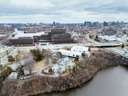 Aerial view of Earnscliffe National Historic Site in Ottawa surrounded by winter landscape and modern buildings. g.の写真素材