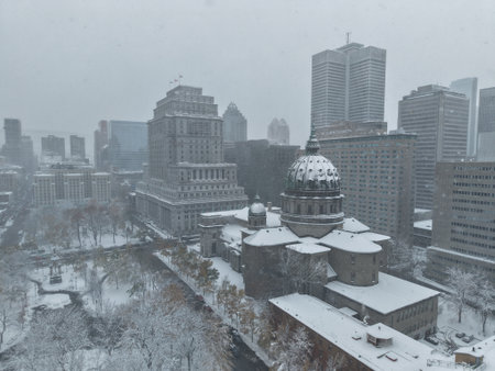 17th of november 2025 drone flight above the Snowy Montreal downtown with Mary Queen of the World Cathedral during snowfall and storm. g.の写真素材