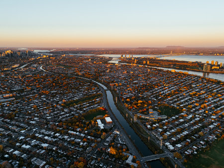 Aerial view of Montreals Angrignon park and urban forest at sunset near cityscape. g.の写真素材