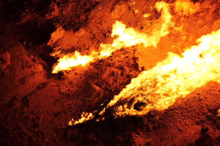 Burning Darvaza gas crater in Karakum Desert at sunset, natural fire pit in Turkmenistan. g.の写真素材