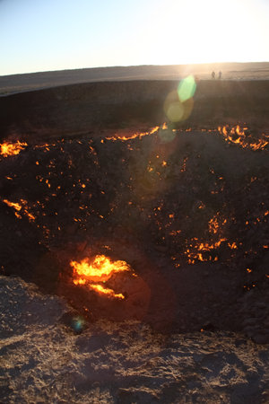 Burning Darvaza gas crater in Karakum Desert at sunset, natural fire pit in Turkmenistan. g.の写真素材