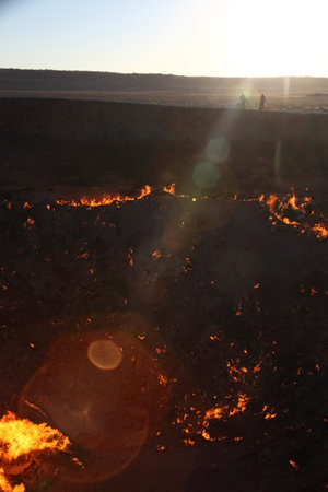 Burning Darvaza gas crater in Karakum Desert at sunset, natural fire pit in Turkmenistan. g.の写真素材