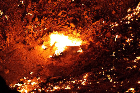 Burning Darvaza gas crater in Karakum Desert at sunset, natural fire pit in Turkmenistan. g.の写真素材