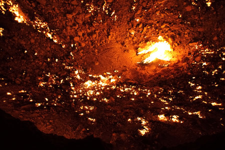 Burning Darvaza gas crater in Karakum Desert at sunset, natural fire pit in Turkmenistan. g.の写真素材