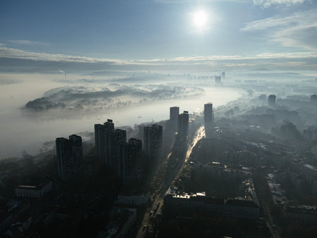 Drone aerial view of Belgrade city in the smog and fog in the morning. Zemun and New Belgrade district, Serbiaの写真素材