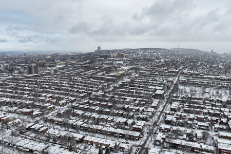 Aerial winter view of snow covered residential rooftops and brick houses in Montreal, Quebec, Canada urban neighborhood. g.の写真素材