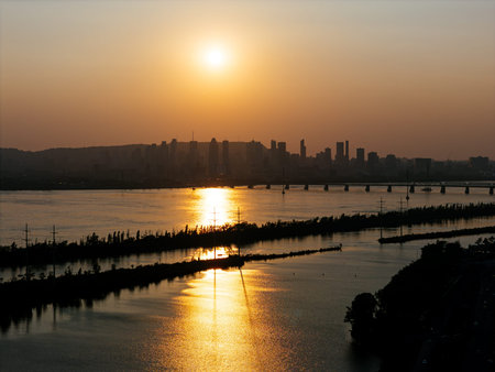 Cable stayed bridge over St Lawrence River at golden sunrise near Montreal and Brossard, Canada. g.