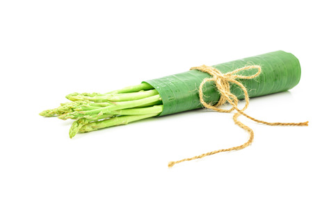 fresh green asparagus on white backgroundの写真素材