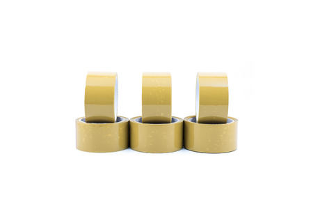 Reels of brown packaging tape on white backgroundの写真素材