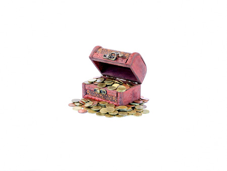 wooden treasure chest with gold coins isolate on white backgroundの写真素材