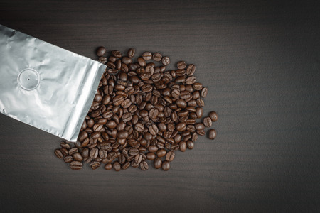 Top view coffee beans in aluminum foil bag packageの写真素材