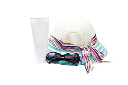 Hat , sunglasses and body lotion isolated on white backgroundの写真素材