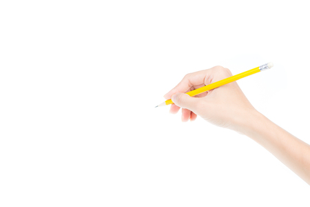 Woman's hand holding a pencil isolated on white backgroundの写真素材