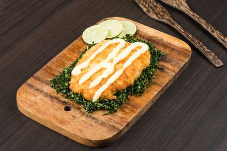 Fied crispy chicken with sauce on wood tableの写真素材