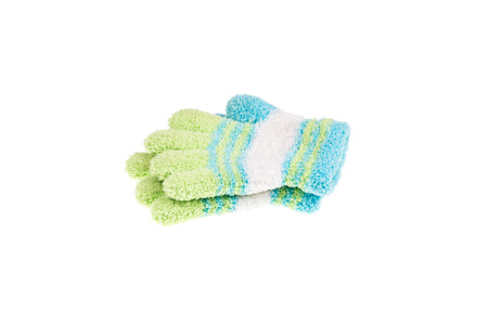 Used knitted children glove, isolated on white backgroundの写真素材