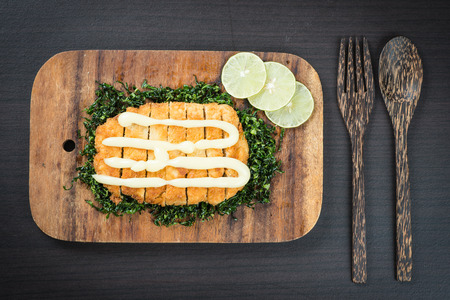 Fied crispy chicken with sauce on wood tableの写真素材