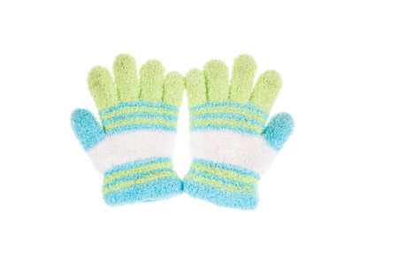 Used knitted children glove, isolated on white backgroundの写真素材