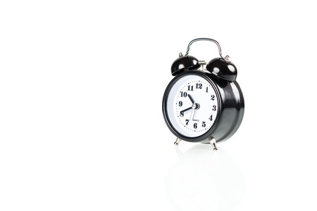 Black alarm clock isolated on white backgroundの写真素材