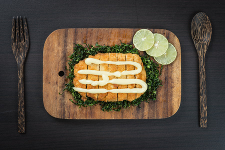 Fied crispy chicken with sauce on wood tableの写真素材