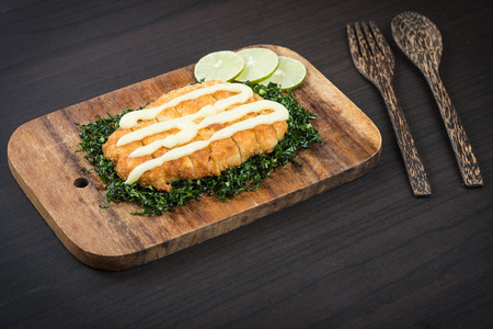 Fied crispy chicken with sauce on wood tableの写真素材