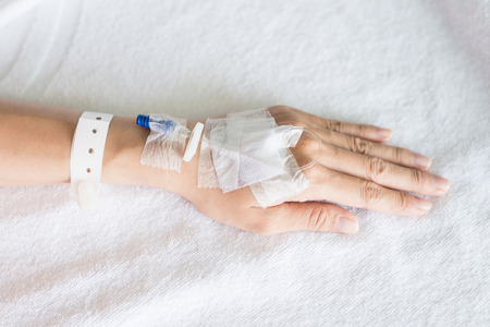 Woman hand with IV drip needleの写真素材