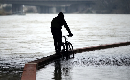 Flooded bike path after high water on a river.の写真素材
