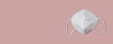 Anti virus protection mask ffp2 standart to prevent corona COVID-19 infection. Panoramic image with copy space.の写真素材