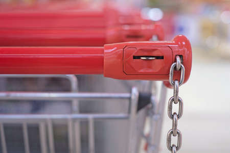 Closeup of a shopping trolley locking system. Horizontal image with soft focus.