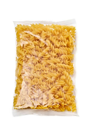 Fusili pasta in plastic package isolated in white background.の写真素材