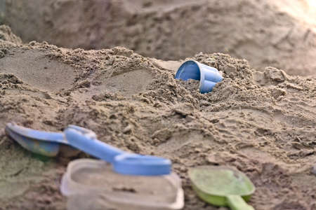 Plastic toys on Children's sandbox. Horizontal image with selective focus.の写真素材