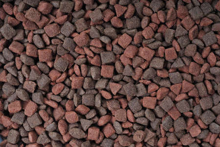 Multi colored dry food for cats and dogs. Horizontal background texture.の写真素材