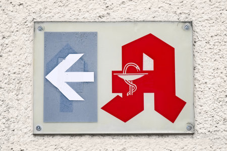 Ulm, Germany - February, 20, 2023: generic 'A' for Apotheke, the German universal sign for pharmacy. direction sign.のeditorial素材