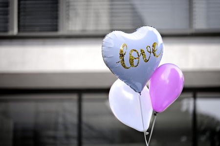 Heart shaped balloon with Love inscription. Horizontal image with selective focus.の写真素材