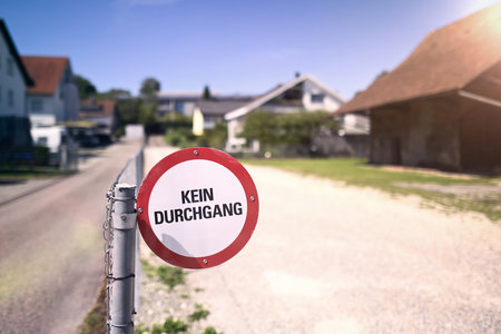 German sign " KEIN PASSAGE " meaning NO TRESPASSING. Horizontal image with selective focus.の写真素材
