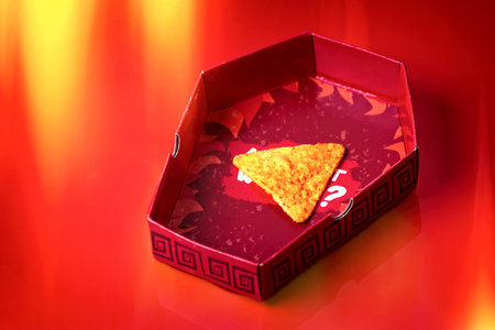 Neu-Ulm, Bavaria, Germany - September, 16, 2023: Corn tortilla chip for hot chip challenge.