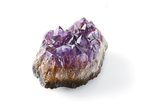 Purple amethyst isolated on white background.の写真素材