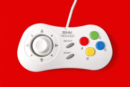 Neu-Ulm, Bavaria, Germany - July, 08, 2024: Neo Geo game controller, developed by SNK isolated on...