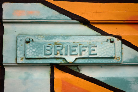 Old colorful letterbox at a door in Germany.の写真素材