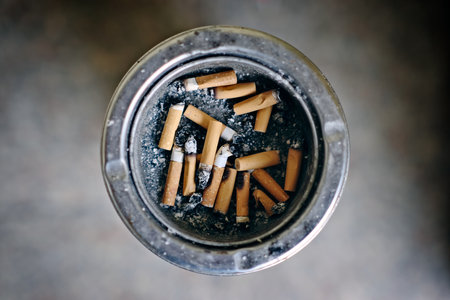 Directly Above Shot Of Cigarette Butts In Ashtray. Horizontal image with selective focus.の写真素材