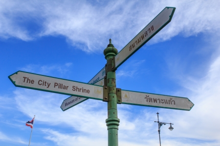 Sign with directions to Thailand s landmarks with bule sky backgroundの写真素材