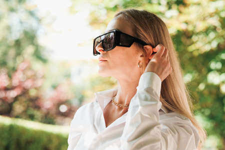 Close Up Portrait of Confident Woman Walking in the City, Female Entrepreneur Wearing Sunglasses and...