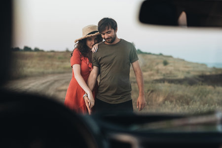 View Through Front Window of Car, Young Couple Man and Woman Having Fun Time Together Outdoors Near...